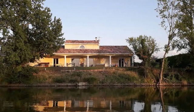 Contemporary house with heated swimming pool on the edge of a private lake. paradise