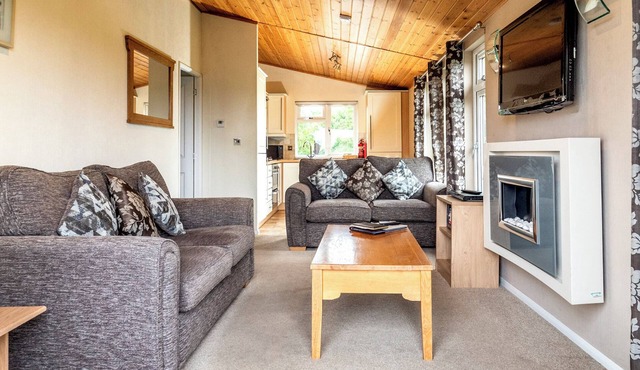 Contemporary luxury lodge with luxurious king-size bed.