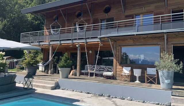 Contemporary wooden villa, clear view of Lake and mountains.nWith spa & pool.
