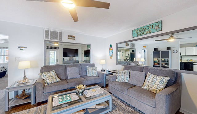 Convenient first-floor condo with a fully stocked kitchen, WiFi & a private deck