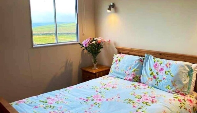 Converted container cabin set in a 40 acre farm with stunning panoramic views