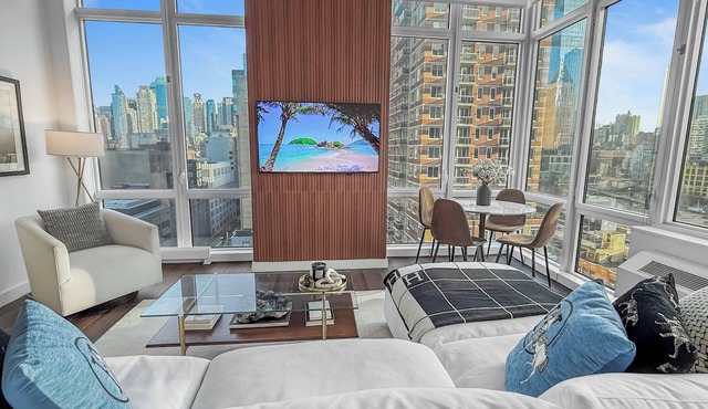 Corner Skyline Living 1BR with Floor to Ceiling Views Walk to Times Square