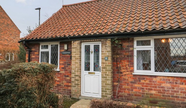 CORNERWAYS, 8 NORTH LANE, with a garden in Haxby