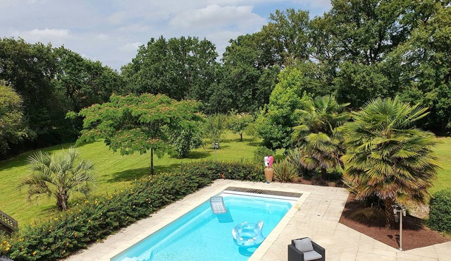 Cosy house with swimming pool in landscaped grounds