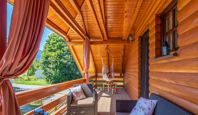 Cosy rustic wooden house with garden and barbecue, not too far from bathing facilities.