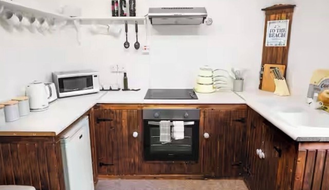 Cosy Seaside Apartment in old stone cottage, steps from the beach.