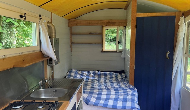 Cosy shepherds hut for two, with balcony, set alone in a hectare of land.