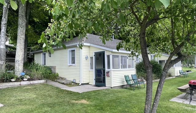 Cottage 1 is a charming 2 bedroom only 25’ from its boat dock & Hamlin lake.