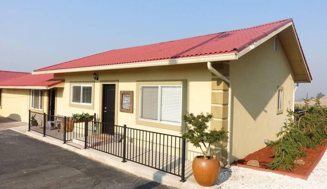 Cottage 1 offers a king-sized bed, dining area, full kitchen, hot tub.