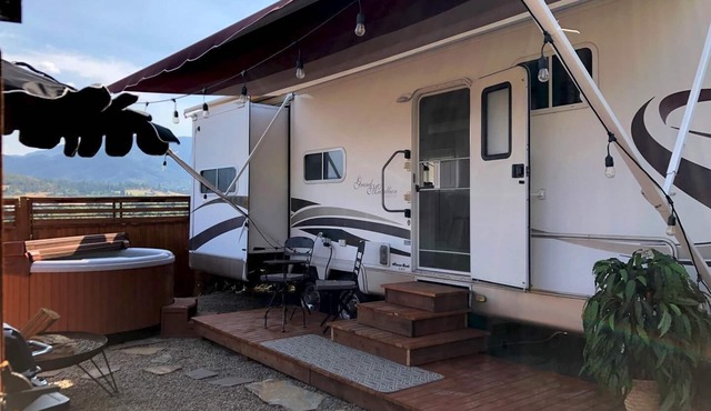 Cottage features a queen-sized bed, dining area, and full kitchen.