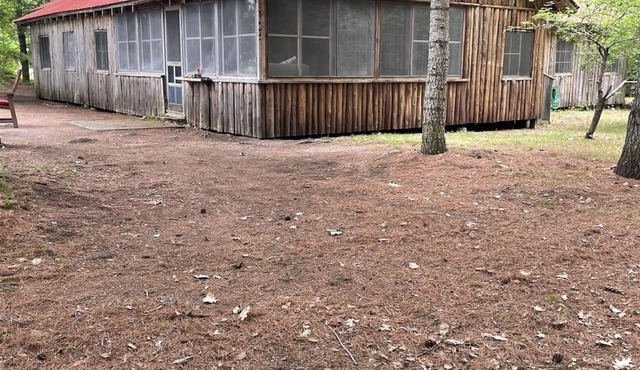 Cottage nestled in the woods overlooking Sebago Lake.