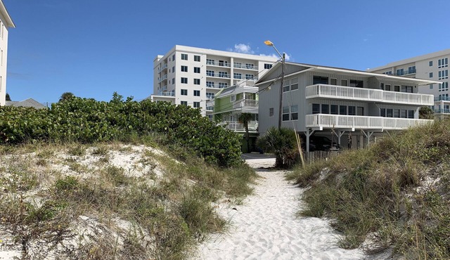 Cottage on the beach! 30 second walk away! Heated pool on the property!