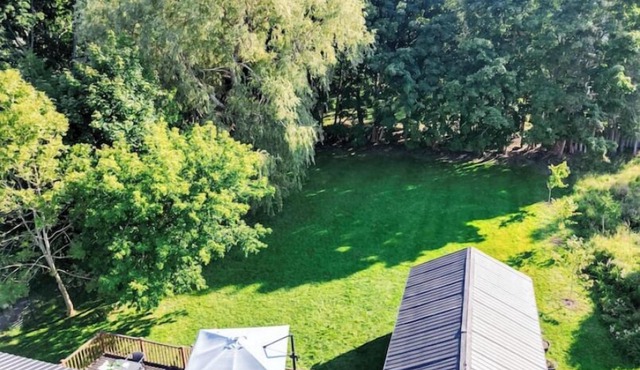 Cottage retreat in town! Spacious with large backyard.