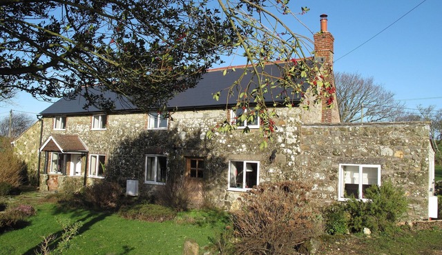 Cottage Set In Rolling Countryside