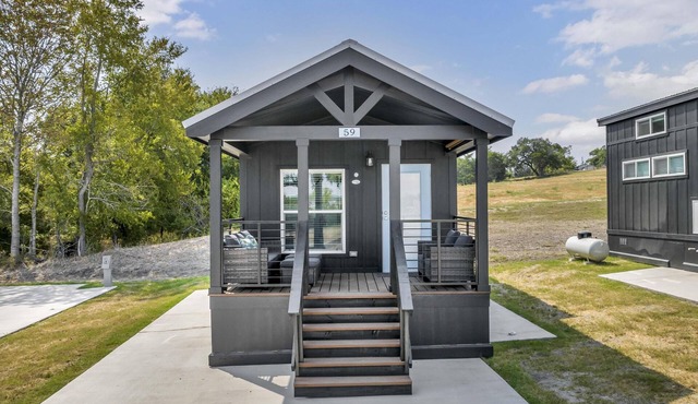 Cottage with Bunk Beds - Includes 1 queen bed in the master, 2 bunk beds and 1 queen bed in the loft. A fully equipped kitchen, dining area, private bath and shower, TVs, Wifi, all utilities, access to all resort amenities. This cottage is pet friend