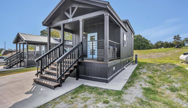 Cottage with Loft - Includes 3 queen beds (one in master and 2 in loft), a fully equipped kitchen, dining area, private bath and shower, TVs, Wifi, all utilities, access to all resort amenities. Pets are not permitted in this cottage.