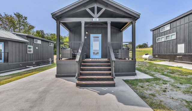Cottage with Loft - Pet Friendly - Includes 3 queen beds (one in master and 2 in loft), a fully equipped kitchen, dining area, private bath and shower, TVs, Wifi, all utilities, access to all resort amenities. This cottage is pet friendly.