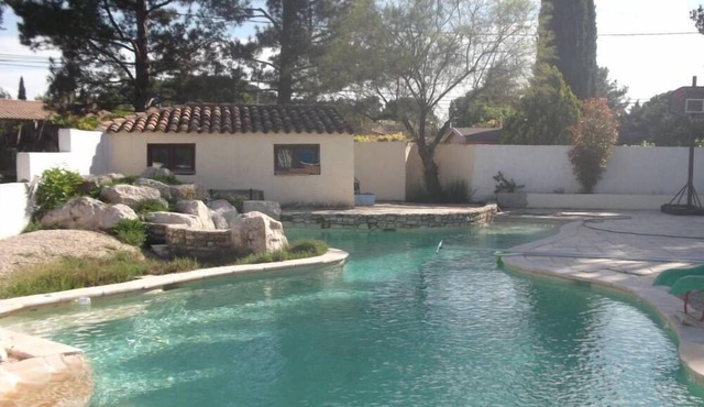 Cottage with private garden in wooded property with swimming pool