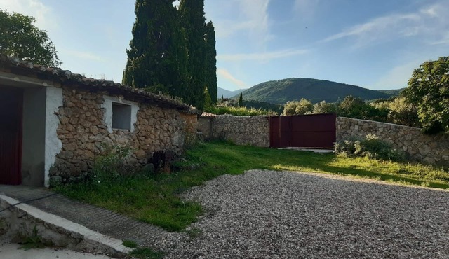Cottage. With stables and horses