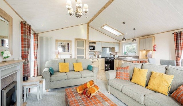 Country and modern cladded lodge with sea views.