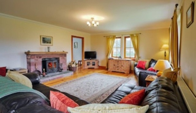 Country farmhouse sleeps 9 with enclosed garden and games barn.