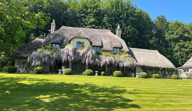 Country farmhouse surrounded by lakes green fields with private spa