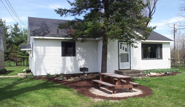 Country home with flowing river