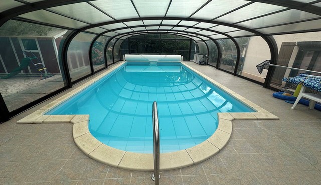 Country house with a covered, heated pool and a large, enclosed garden
