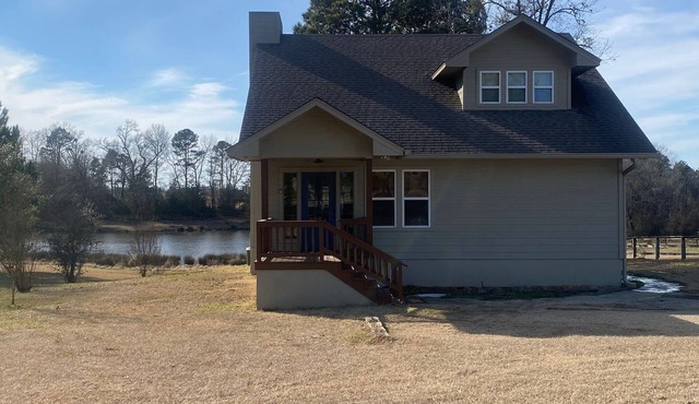 Country living with a cozy cabin and a fishing pond out back for your enjoyment!