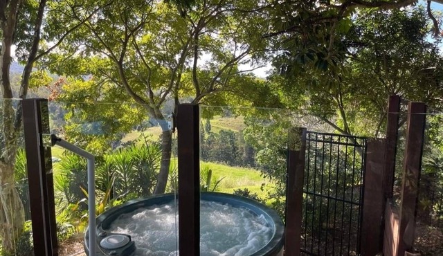 Country Retreat, relax in the spa, or on the deck, while taking in the view.