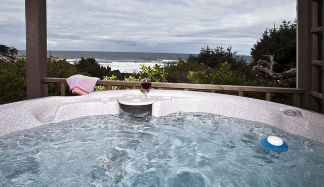 Covered hot tub to Enjoy the rolling surf and ocean sounds