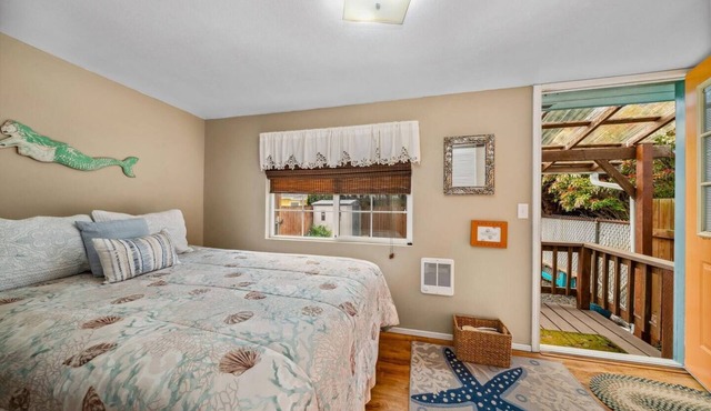Cozy 1936 cottage with private fenced yard, fire pit, pets welcome, and an easy walk to the beach.