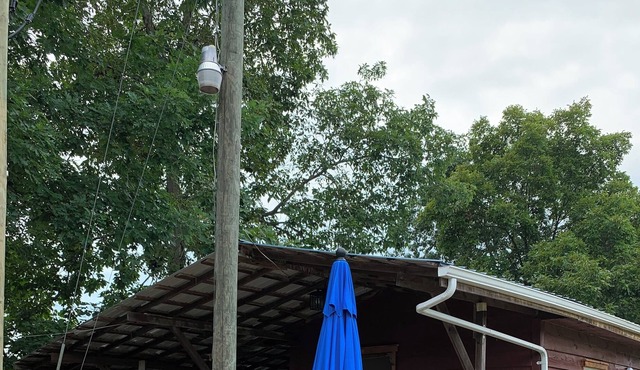 Cozy 2-bedroom cabin with view of Millcreek in and a private dock.