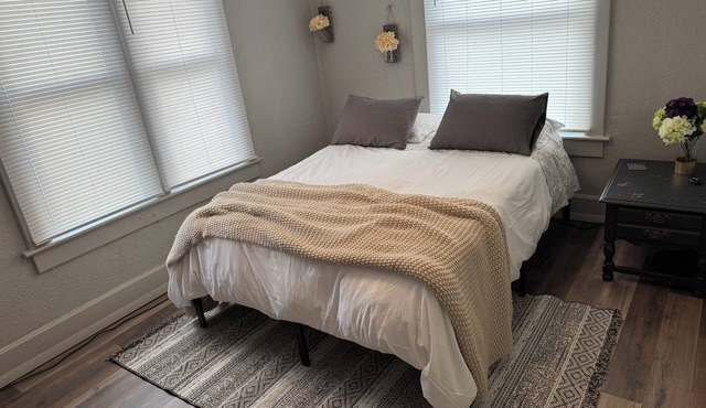 Cozy 2 Bedroom, with a Queen Bed in each, fire place, vanity, dresser, &two tv’s