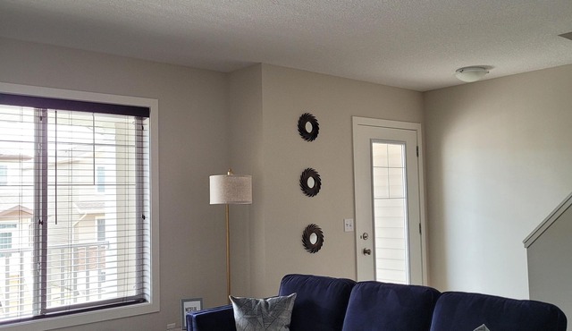 COZY 2-BR TOWNHOUSE. Private ATTACHED GARAGE and BALCONY. Near YQR AIRPORT.