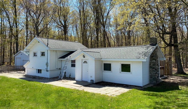 Cozy 3-bedroom cottage, large yard, minutes from Lake Michigan. Pet friendly.