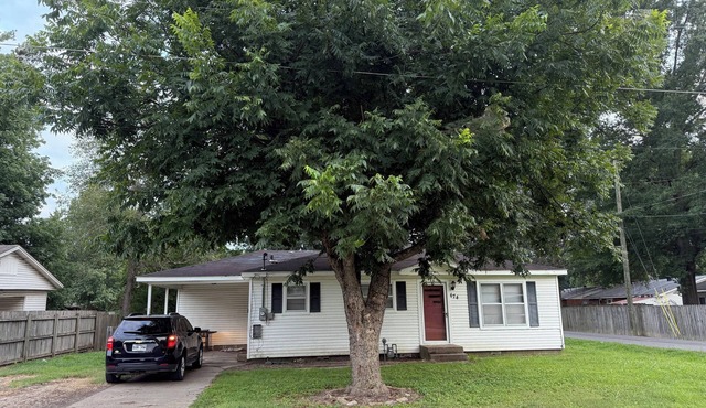 Cozy 3-Bedroom Cottage with Carport & Shaded Yard. Nestled under a big tree.