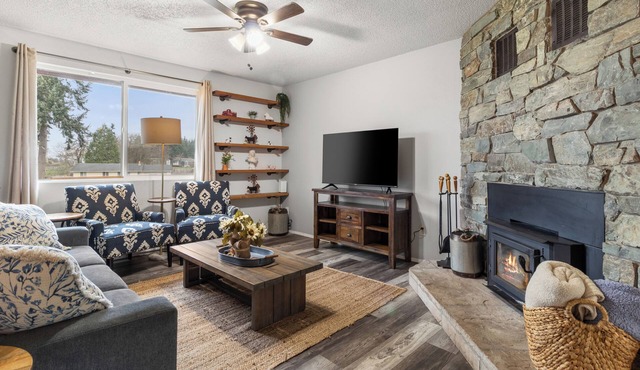 Cozy 3BR modern farmhouse in Rochester with stone fireplace, fenced yard, and easy I-5 access.