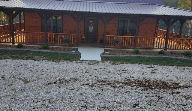 Cozy 4-bedroom cabin with a private lake. Pet Friendly.