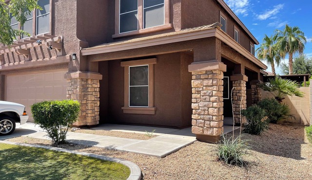 Cozy 4-bedroom home with spacious loft, pool, & game room in Litchfield Park