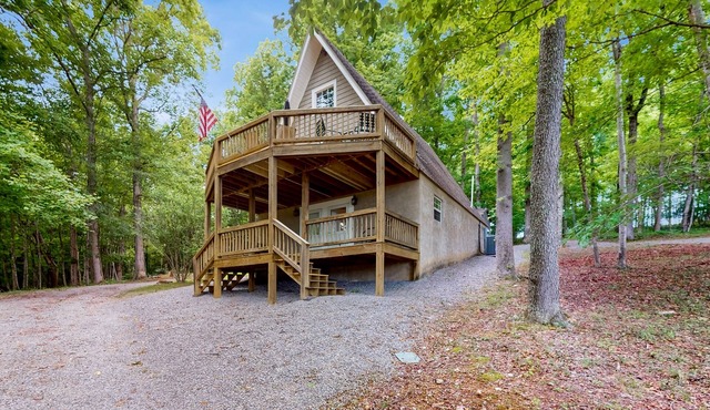 Cozy A-frame home with fire pit, deck, pickleball court, and covered boat slip