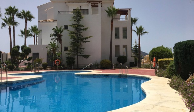 Cozy apartment with beautiful view on golf course, mountains and nature reserve.