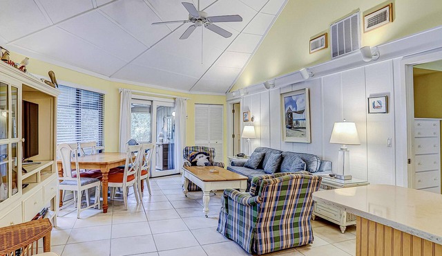 Cozy bungalow offers privacy, shared pool, and beach access via dedicated trail