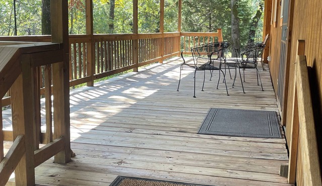 Cozy cabin in a country setting with a private porch for relaxing and WiFi.