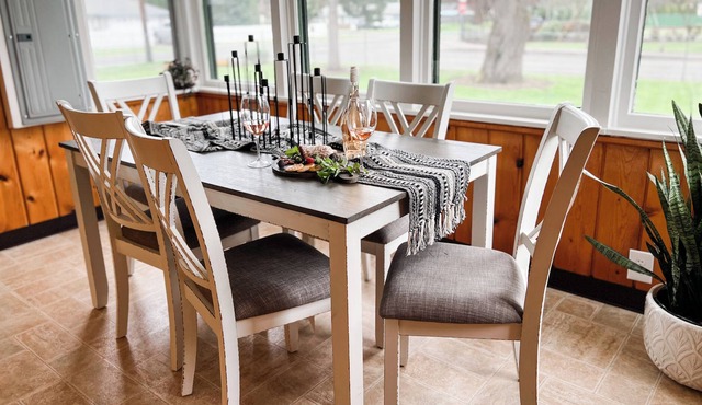 Cozy cabin in town w/ sunroom, huge playset/backyard, dog yard, fire pit, BBQ