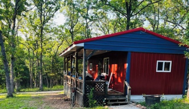 Cozy Cabin nestled on 10 acres just minutes from the lake and the speedway