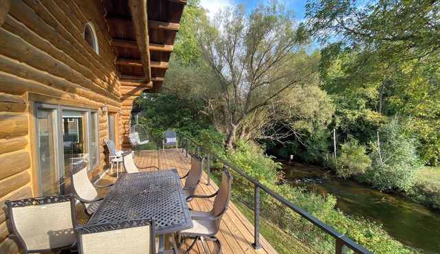 Cozy cabin on the Pentwater River with hot tub, central air and ample parking.