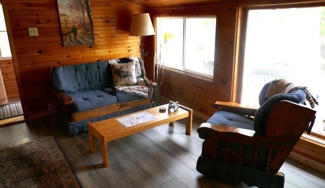 Cozy cabin with a lake front view.