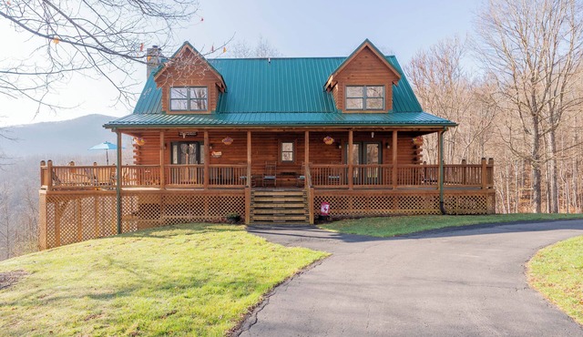 Cozy cabin with mountain views, game room, fire pit, soaking tub, and bright gathering spaces