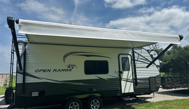 Cozy camper with queen Murphy bed, bunks, and dinette conversion bed.